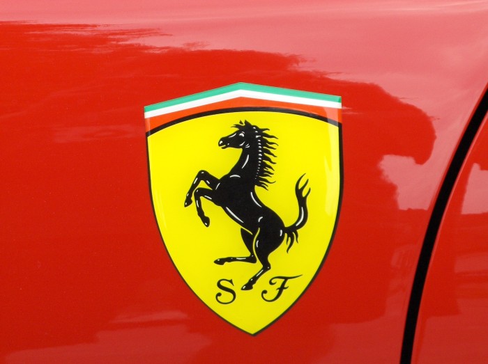 Ferrari logotype on the red racing car